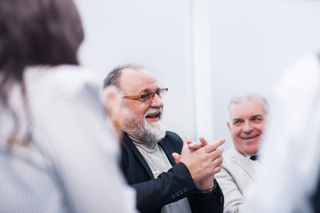 close up. business colleagues discussing the project sitting at the office Desk.