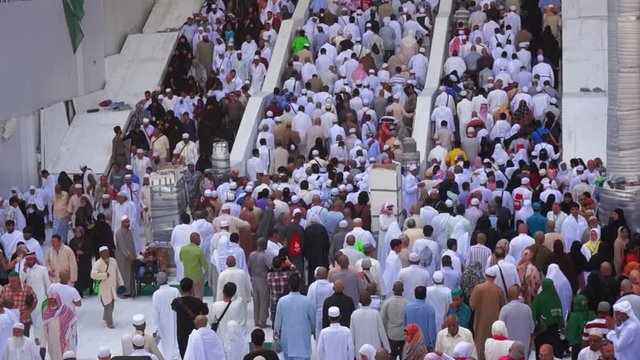 Muslim pilgrims use stairs to exit the Haram Mosque after afternoon prayer in Makkah, Saudi Arabia.