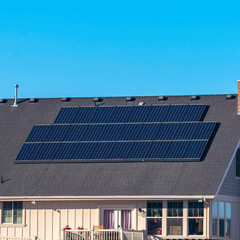 Square Urban house with solar panels on the roof