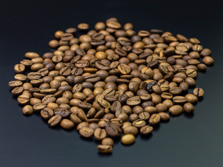 pile of coffee beans isolated on gray background