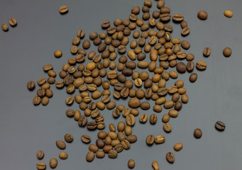 pile of coffee beans isolated on gray background