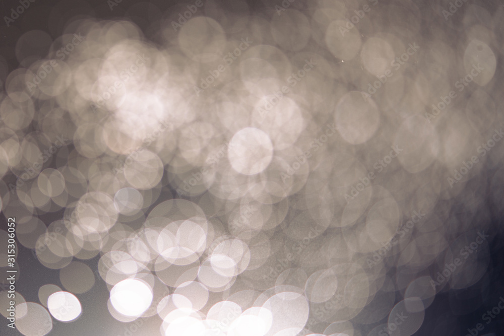 Aufkleber abstract bokeh from light and water spray in backgrounds of various colors