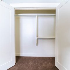 Square frame Empty interior of an open white closet
