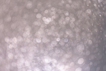 Abstract bokeh from light and water spray in backgrounds of various colors