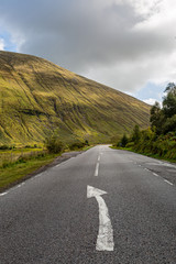 Rugged mountains alongside a road in Scotland