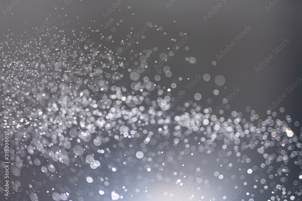 Poster abstract bokeh from light and water spray in backgrounds of various colors