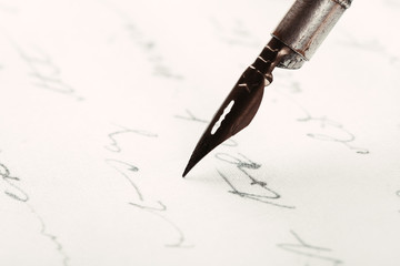 Fountain pen on an ancient handwritten letter. Old story. Retro style.