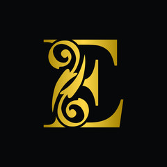Gold letter E. Vintage golden flower ornament initial letters.  Alphabet. Logo vector 