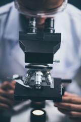 Fototapeta na wymiar Close-up shot of microscope with metal lens at laboratory.