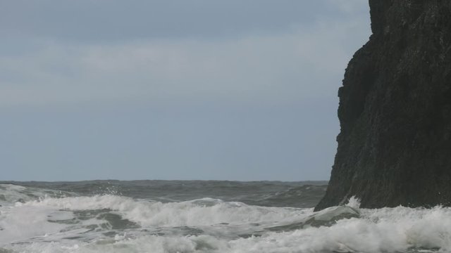 Big storm waves weather pacific ocean hitting crashing into cliff rock blue sky Pacific Northwest Oregon
