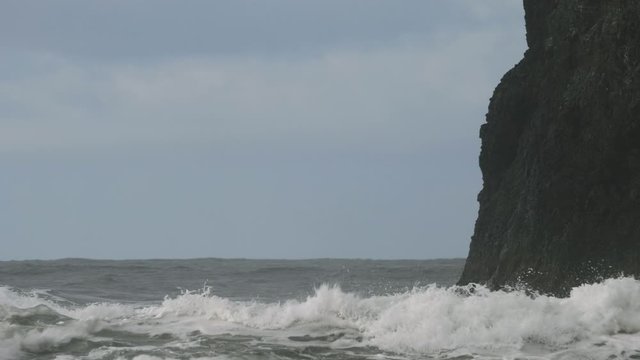 Big storm waves weather pacific ocean hitting crashing into cliff rock blue sky Pacific Northwest Oregon