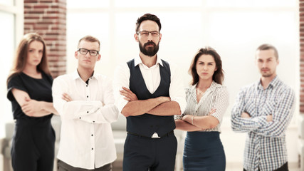confident business team standing in a modern office