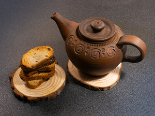 clay teapot and bread crumbs