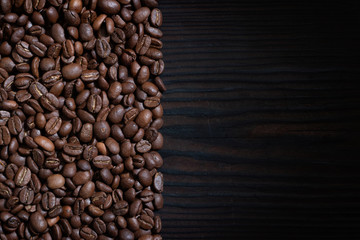 Coffee beans on wood background