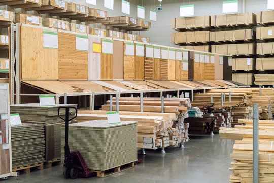 Selling wooden planks at a hardware store