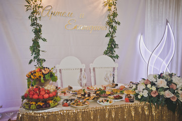 Large festive table with a variety of dishes and decorations 2432.