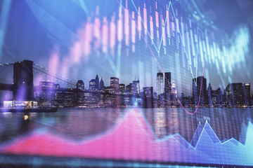 Financial graph on night city scape with tall buildings background double exposure. Analysis concept.
