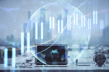 Forex Chart hologram on table with computer background. Multi exposure. Concept of financial markets.