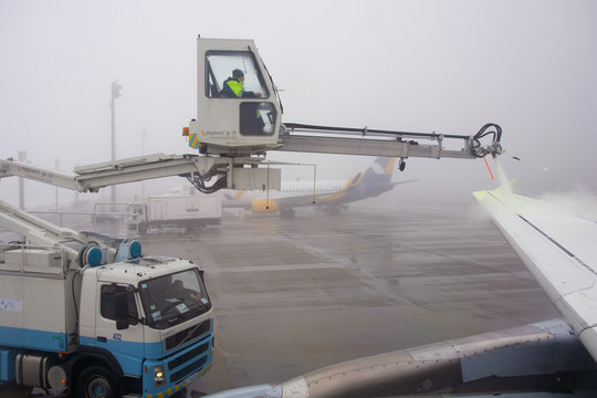 Boryspil, Kyiv / Ukraine - Feb 1st 2019 - Airplane is being prepared for flight. The wing is sprayed by liquid to prevent icing in Kyiv international airport Boryspil (KBP) on the 1st February 2019.