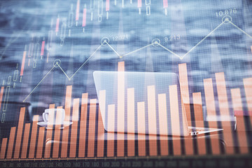 Financial market graph hologram and personal computer on background. Double exposure. Concept of forex.