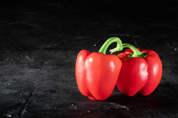 Red peppers, sweet paprika on dark background