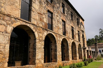 Fototapeta premium View to historic restored museum of Sanctuary Caraça with arches and windows, Minas Gerais, Brazil