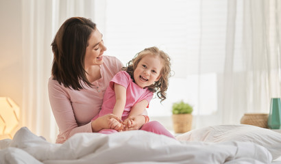girl and her mother enjoy sunny morning