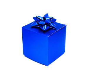 Blue paper gift box with ribbon on top on white background.