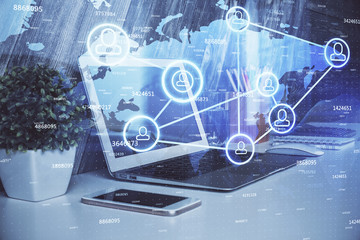 Computer on desktop with social network theme icon. Multi exposure. Concept of international connections.