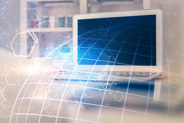 Multi exposure of table with computer and world map hologram. International data network concept.