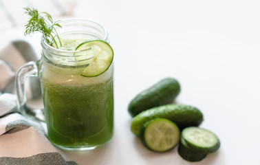 the process of making fresh juice or cucumber smoothies, detox smoothies and juices, weight loss diet