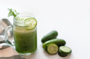 the process of making fresh juice or cucumber smoothies, detox smoothies and juices, weight loss diet