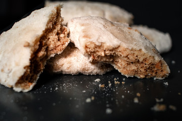 Pastries with powdered sugar and dark background. Typical spanish Christmas sweets.