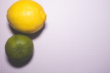 lime and lemon fruit on background