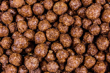 Texture of chocolate cereal balls for the background