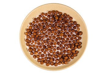 Ceramic plate with chocolate cereal balls in milk isolated on a white background