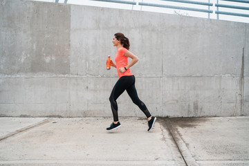 Portrait of fitness woman running.