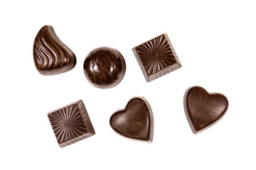 Heap of chocolate candies isolated on a white background