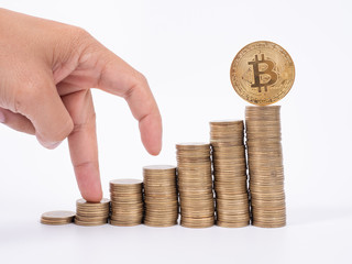 Man's hand put money coins to stack of  cryptocurrency. Money, Financial, Business Growth concept