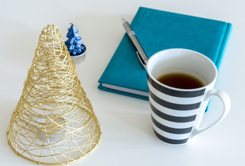 New Year's Resolutions for the New Year 2020, Notebook with Ready Pen, New Goals and Commitments and Promises, Christmas Holiday Decorations, Warm Tea and New Year Events, Golden Tree © Martin