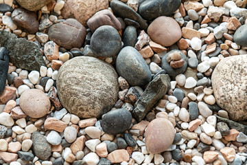 abstract background with sea stones of different sizes, pebbles on the beach