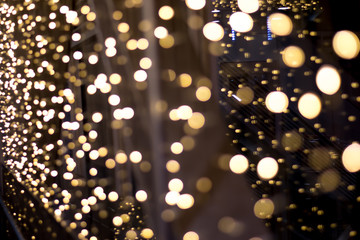 Golden christmas background with bokeh lights