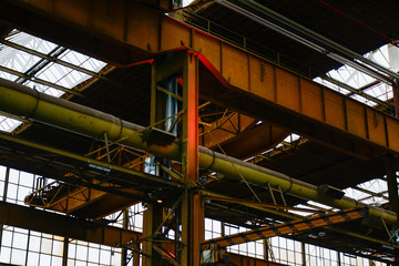 Fototapeta premium Industrial interior of an old rusty factory building