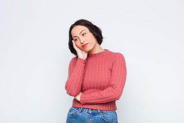 young pretty woman feeling bored, frustrated and sleepy after a tiresome, dull and tedious task,...