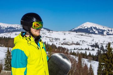 man in helmet and ski mask. reflection. winter activity