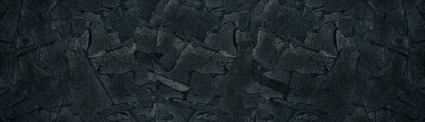 Black plaster strokes wide texture. Stucco wall rough surface. Large dark grunge background