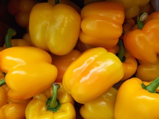 organic yellow bell peppers in market place