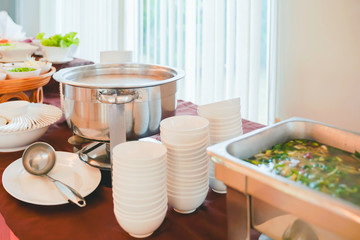 stainless pot of boiled rice , ready for serving customer in hotel