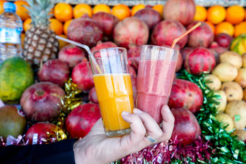 Mixed fruit juice and fresh orange juice on fruit background