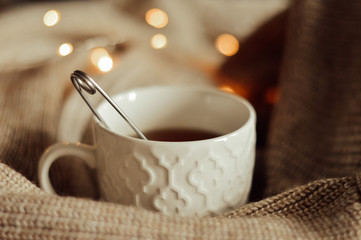 cup of coffee and garland lights
